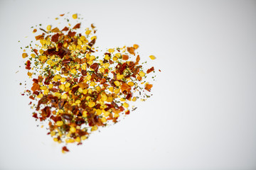 heart made of pepper seeds autumn leaves