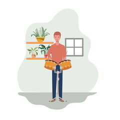 young man with timpani and houseplants of background