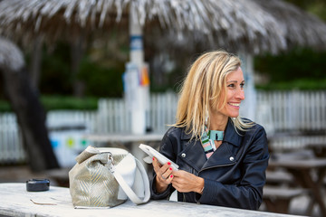 woman , texting in a smartphone.