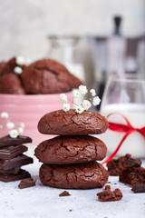 Chocolate brownie cookies served with glass of milk