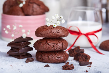 Chocolate brownie cookies served with glass of milk