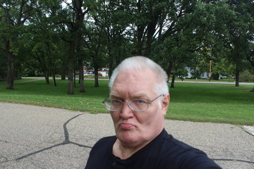 portrait of senior man in park