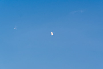 Blue sky and half moon