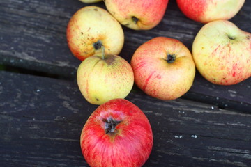  Ripe apples on the board in autumn