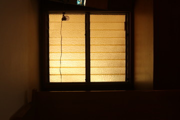 yellow window in the wall