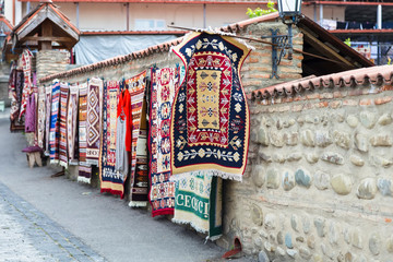 Fototapeta na wymiar Sale of carpets with Georgian national patterns