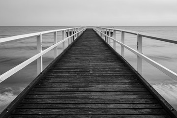 Wooden sea pier black and white