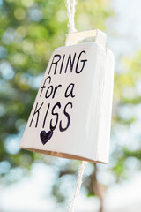 western themed wedding decoration, white cowbell that says ring for a kiss, shabby chic, country chic, diy wedding decor, country themed wedding