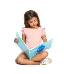 Cute little girl reading book on white background