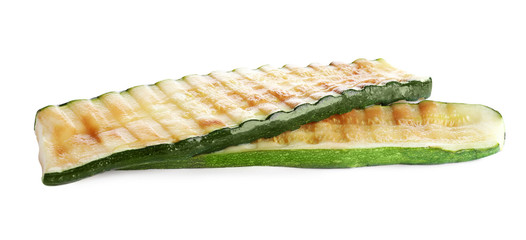 Delicious pieces of grilled zucchini on white background