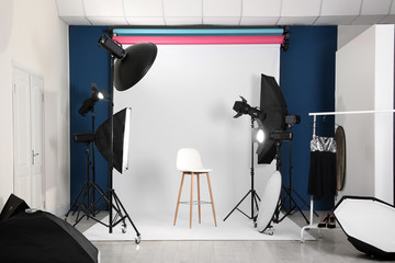 Photo studio interior with set of professional equipment