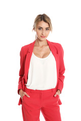 Fototapeta premium Beautiful young woman in red suit posing on white background