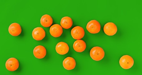 Fruit pattern of fresh orange tangerine or mandarin on green background. Flat lay, top view. Pop art design, creative summer concept. Citrus in minimal style.