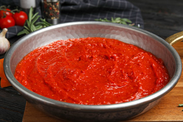 Delicious tomato sauce in pan, closeup view
