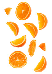 falling fresh orange fruit slices isolated on white background closeup. Flying food concept. Top view. Flat lay. Orange slice in air, without shadow.