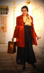 Young women traveling whit red coat