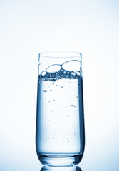 water glass on blue background