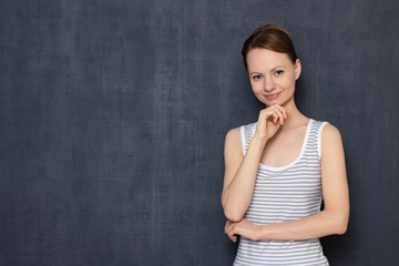 Portrait of happy girl propping head with hand
