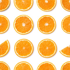 Seamless pattern of orange fruit slices. Orange slices isolated on white background. Food background. Flat lay, top view.