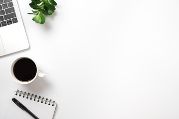 Flay lay, Top view office table desk with smartphone, keyboard, coffee, pencil, leaves with copy space background.