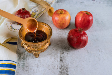 Apple and honey, kosher traditional food of jewish New Year Rosh Hashana talit and shofar