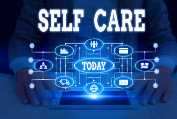 Writing note showing Self Care. Business concept for the practice of taking action to improve one s is own health Woman wear formal work suit presenting presentation using smart device