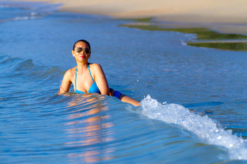 Woman shape huge and bikini blue happy at the beach