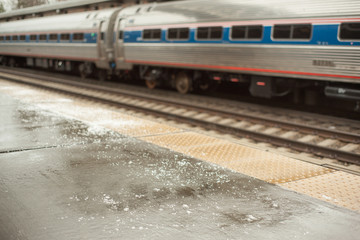 Fototapeta premium Icy train station platform has been salted