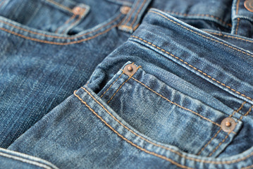 Fototapeta premium Blue jeans pockets and rivet