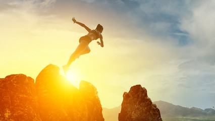 Jumping over precipice, challenge concept.