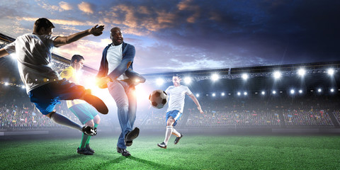 Soccer man in action with ball. Mixed media