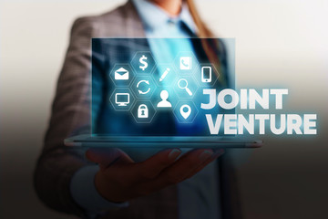 Handwriting text writing Joint Venture. Conceptual photo Collaboration Arrangement Parties Partnership Team