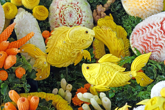 Beautiful Thai style carving fruits and vegetables in fish among sea anemones shaped. Royal Thai cuisine decorative style. Selective focus
