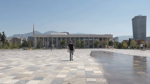 Tirana, Albania,August 2019:people walking at National Opera and Ballet Theatre