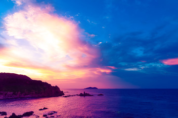 Fototapeta na wymiar Chenghai Mountain, Weihai, Shandong, China, overlooking Donkey island Island Sunset Pink Sky.