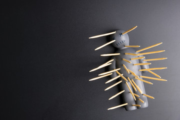 .Voodoo Doll on a black background with dramatic lighting.