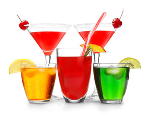 Different tasty cocktails on white background