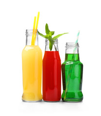 Different tasty cocktails on white background