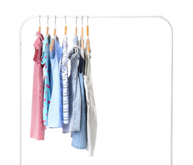 Rack with hanging clothes on white background