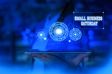 Text sign showing Small Business Saturday. Business photo text American shopping holiday held during the Saturday Woman wear formal work suit presenting presentation using smart device