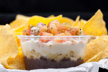Nachos with Salsa Sauce and Yogurt, traditional snack from Mexico
