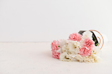 Bouquet of beautiful flowers on light table