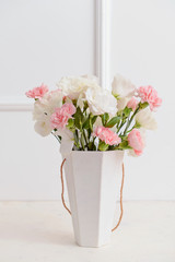 Bouquet of beautiful flowers on light table