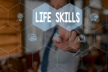 Conceptual hand writing showing Life Skills. Concept meaning skill that is necessary for full participation in everyday life Woman wear work suit presenting presentation smart device