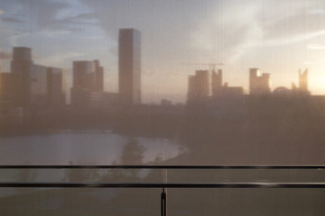 A rising new town viewed through roller shades during sunset in Ningbo, China.