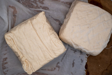 Tahu or tofu made from fermented soybean milk, a vegan friendly protein source 