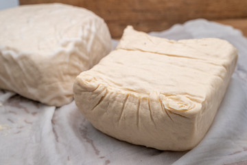 Tahu or tofu made from fermented soybean milk, a vegan friendly protein source 