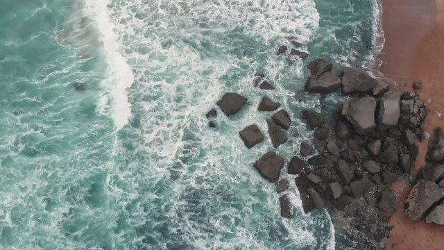 Aerial overhead shot of Ocean Waves crushing on the Beach in Biarritz Resort - Basque Country South West of France