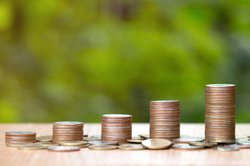 Finance and Saving money concept,coin stacks on the wooden background