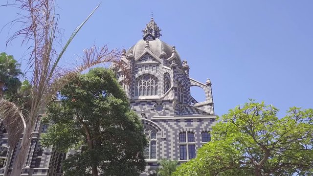 Opening sliding 4k shot of Plaza Botero and Palace Uribe